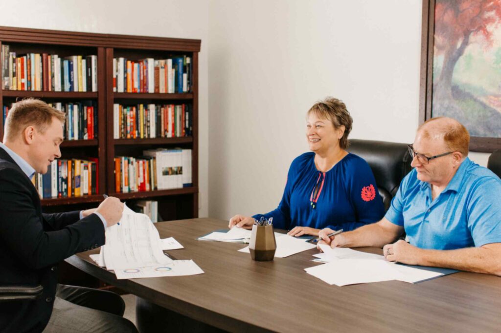 Saint Louis financial advisor Michael Becker working with clients on their retirement portfolio