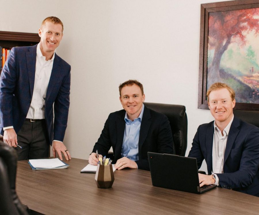 Fiduciary financial advisors Craig Toberman (left), Michael Becker (center), and Mike Holtz (right) working on a comprehensive financial plan.